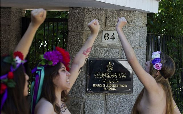 Activists of FEMEN shout for the release of fellow activists, who are imprisoned in Tunisia during a protest outside the Tunisian embassy in Madrid, Spain Wednesday June 12, 2013. (photo credit: AP/Paul White) Activists of FEMEN shout for the release of fellow activists, who are imprisoned in Tunisia during a protest outside the Tunisian embassy in Madrid, Spain Wednesday June 12, 2013. (photo credit: AP/Paul White)