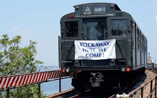 A 1930s era subway makes its way along the tracks in the Queens borough of New York, Thursday, May 30, 2013, commemorating the opening of a stretch of subway tracks badly damaged during Superstorm Sandy in late October 2012. (photo credit: AP Photo/Mass Transit Administration, Patrick Cashin) A 1930s era subway makes its way along the tracks in the Queens borough of New York, Thursday, May 30, 2013, commemorating the opening of a stretch of subway tracks badly damaged during Superstorm Sandy in late October 2012. (photo credit: AP Photo/Mass Transit Administration, Patrick Cashin)