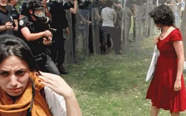 A Turkish policeman approaches the woman in the red dress (photo credit: Youtube screenshot)