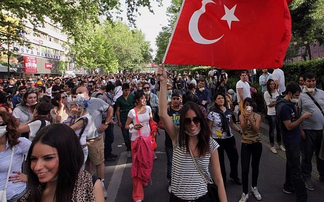 Young Turks walk during a protest in Ankara, Turkey, Sunday, June 2 (photo credit: AP/Burhan Ozbilici) Young Turks walk during a protest in Ankara, Turkey, Sunday, June 2 (photo credit: AP/Burhan Ozbilici)