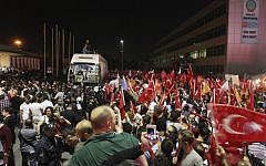 The crowd cheers for Turkish Prime Minister Recep Tayyip Erdogan's arrival at the Ataturk Airport of Istanbul early Friday, June 7, 2013. (Photo credit: AP/Thanassis Stavrakis)