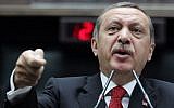 Turkey's Prime Minister Recep Tayyip Erdogan addresses lawmakers at the parliament in Ankara, Turkey, in June (photo credit: AP)