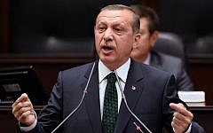 Turkish Prime Minister Recep Tayyip Erdogan addresses his supporters and lawmakers at the parliament in Ankara, Turkey, Tuesday, June 25, 2013 (photo credit: AP)