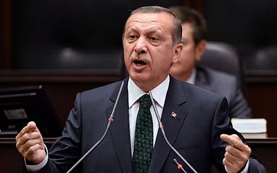 Turkish Prime Minister Recep Tayyip Erdogan addresses his supporters and lawmakers at the parliament in Ankara, Turkey, Tuesday, June 25, 2013 (photo credit: AP)