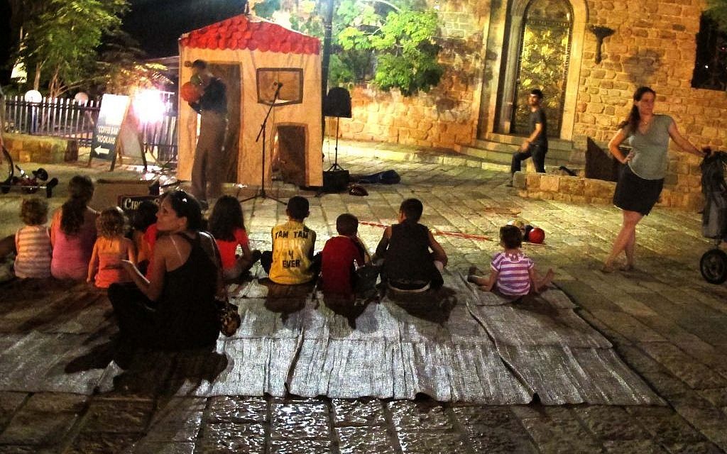 Children got in on the fun of White Night as well, catching some skits and comedy routines on the streets of Jaffa (photo credit: Leeor Bronis/Times of Israel)