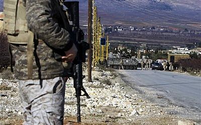 Illustrative photo of Lebanese army soldiers at a checkpoint at the entrance of Arsal, a Sunni Muslim town in eastern Lebanon near the Syrian border, Feb. 2, 2013 (AP Photo/Bilal Hussein)