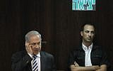 Prime Minister Benjamin Netanyahu speaking on a cellphone during a Knesset session on June 5, 2013 (Miriam Alster/Flash90)