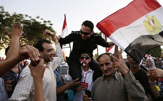 A protest against the Muslim Brotherhood and Egyptian President Mohammed Morsi in front of the Ministry of Defense, in Cairo, Egypt, Wednesday, June 26, 2013 (AP/Hassan Ammar) A protest against the Muslim Brotherhood and Egyptian President Mohammed Morsi in front of the Ministry of Defense, in Cairo, Egypt, Wednesday, June 26, 2013 (AP/Hassan Ammar)