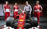 Jerusalem Mayor Nir Barkat with Ferrari technical crew members next to a Ferrari Formula 1 racing car, on display at the Old Jerusalem Train Station, June 9, 2013. (photo credit: Flash 90)