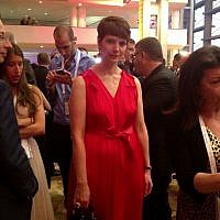 Hila Rahav, wife of PR guru Rani Rahav, in red (photo credit: Sarah Tuttle-Singer/Times of Israel)