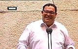 Education Minister Shai Piron laughs during a Knesset debate on June 3, 2013. (screen capture: Youtube/99knesset)