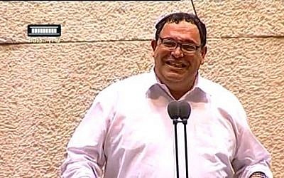 Education Minister Shai Piron laughs during a Knesset debate on June 3, 2013. (screen capture: Youtube/99knesset)