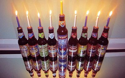 A menorah made of Shmaltz Brewing's He'Brew beer bottles. (photo credit: Shmaltz Brewing Facebook/JTA)
