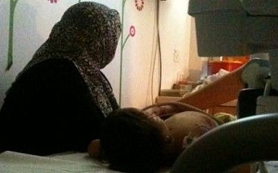 A Syrian mother and daughter at Wolfson Hospital, brought to Israel by Shevet Achim (photo credit: Lazar Berman/Times of Israel)