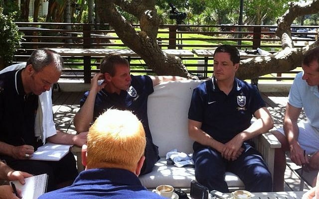 English soccer reporters with Stuart Pearce (facing camera, scratching his head) in Caesarea on Thursday (photo credit: Times of Israel)
