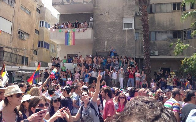 Tel Avivians celebrate the annual gay pride festival, Friday. (photo credit: Times of Israel staff) Tel Avivians celebrate the annual gay pride festival, Friday. (photo credit: Times of Israel staff)