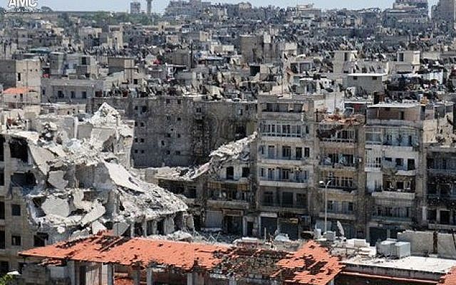 Buildings damaged during battles between Syrian government forces and rebels, in Aleppo, Syria, seen earlier this month (photo credit: AP/Aleppo Media Center AMC)