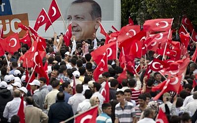 Supporters of Turkish Prime Minister Recep Tayyip Erdogan wait for his arrival in Ankara, Turkey, on Sunday, June 9, 2013. (AP/Vadim Ghirda)