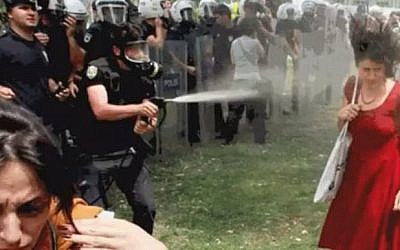 The policeman fires tear gas directly at the woman in the red dress from close range (YouTube screenshot)