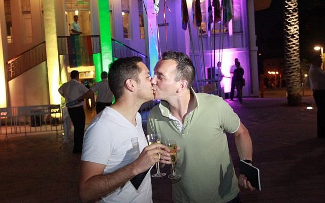 Vincent Autin and Bruno Boileau, France's first gay newlyweds, kiss in Tel Aviv on their honeymoon, June 2013. (photo credit: Courtesy Municipality of Tel Aviv)