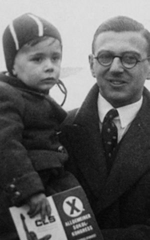 A young Nicholas Winton with a rescued child. (hoto credit: Courtesy of Menemsha Films)