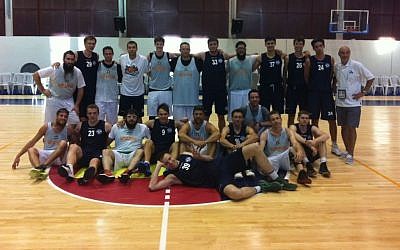 The Russian (blue) and Guinea-Bissau Maccabiah basketball teams (photo credit: Aaron Kalman/Times of Israel) The Russian (blue) and Guinea-Bissau Maccabiah basketball teams (photo credit: Aaron Kalman/Times of Israel)
