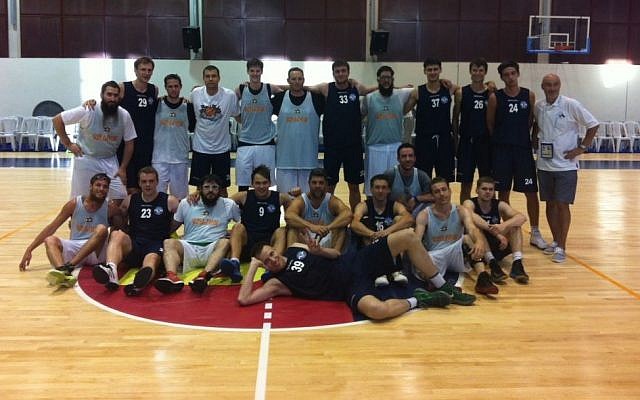 The Russian (blue) and Guinea Bissau Maccabiah basketball teams (photo credit: Aaron Kalman) The Russian (blue) and Guinea Bissau Maccabiah basketball teams (photo credit: Aaron Kalman)