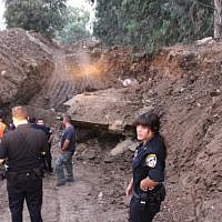 Police examine old Russian tank found in Holon's industrial area July 2, 2013. (Photo credit: Israel Police/Facebook)