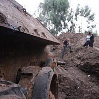 Police in Holon cordone off area near site where Russian tank was found buried underground on July 2, 2013. (Photo credit: Israel Police/Facebook)