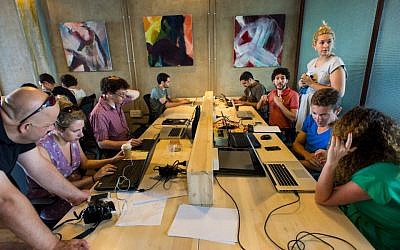 Web and tech pros work at the Do It Good Hackathon (Photo credit: Courtesy)