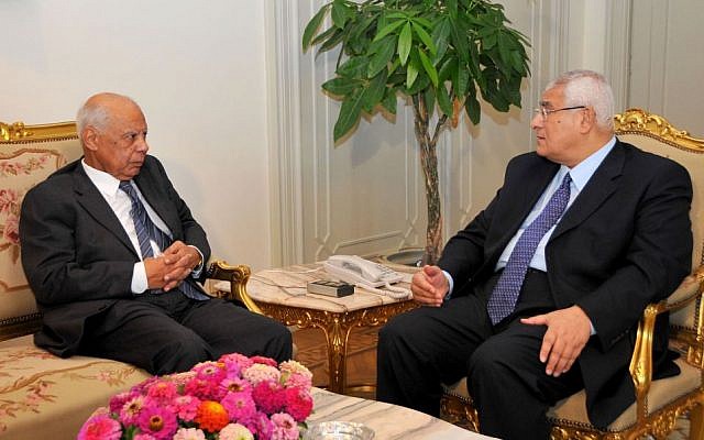 Interim President Adly Mansour, right, meets with Hazem el-Beblawi, left, in Cairo, Egypt, Tuesday, July 9 (photo credit: AP/Egyptian Presidency) Interim President Adly Mansour, right, meets with Hazem el-Beblawi, left, in Cairo, Egypt, Tuesday, July 9 (photo credit: AP/Egyptian Presidency)