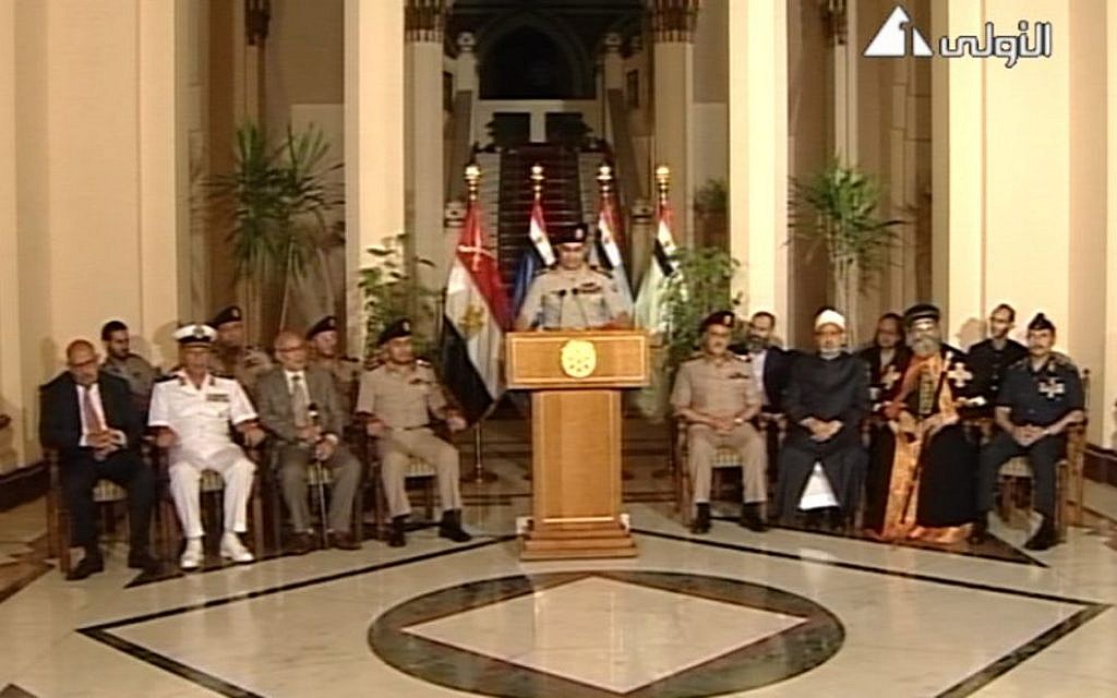 Lt. Gen. Abdel-Fattah al-Sisi, center, flanked by military and civilian leaders, July 3, 2013 (photo credit: AP/Egyptian State Television)