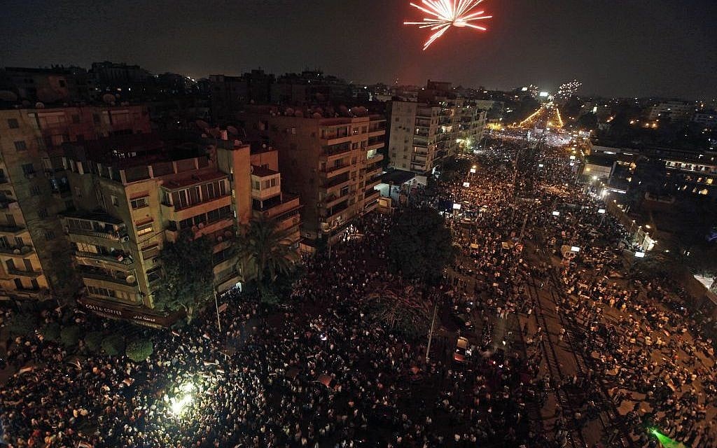 Fireworks light the sky moments after Egypt's military chief says the president is replaced by chief justice of constitutional court outside the presidential palace in Cairo, Egypt on Wednesday. (photo credit: AP/Nariman El-Mofty)