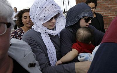 Tsarnaev family members and others depart the federal courthouse in Boston following the arraignment of Boston Marathon bombing suspect Dzhokhar Tsarnaev Wednesday, July 10 (photo credit: AP/Steven Senne)