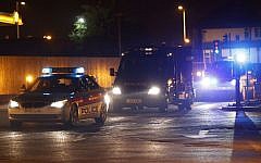 A police van carrying radical cleric Abu Qatada arrives, under escort, at RAF Northolt in London for his deportation to Jordan, where he faces a retrial for his alleged involvement in terrorist plots, on Sunday, July 7, 2013. (photo credit: AP Photo/Sang Tan)