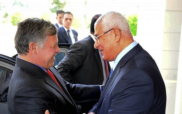 Egyptian President Adly Mansour, right, greets Jordan's King Abdullah II on his arrival to the presidential palace, Saturday, July 20 (photo credit: AP/Egyptian Presidency) Egyptian President Adly Mansour, right, greets Jordan's King Abdullah II on his arrival to the presidential palace, Saturday, July 20 (photo credit: AP/Egyptian Presidency)