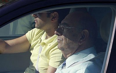 Former defense minister Costas Papacostas, front, is seen in a car as he arrives at the court in southern city of Larnaca, Cyprus, on Tuesday, July 9, 2013. (photo credit: AP Photo/Andreas Lazarou)