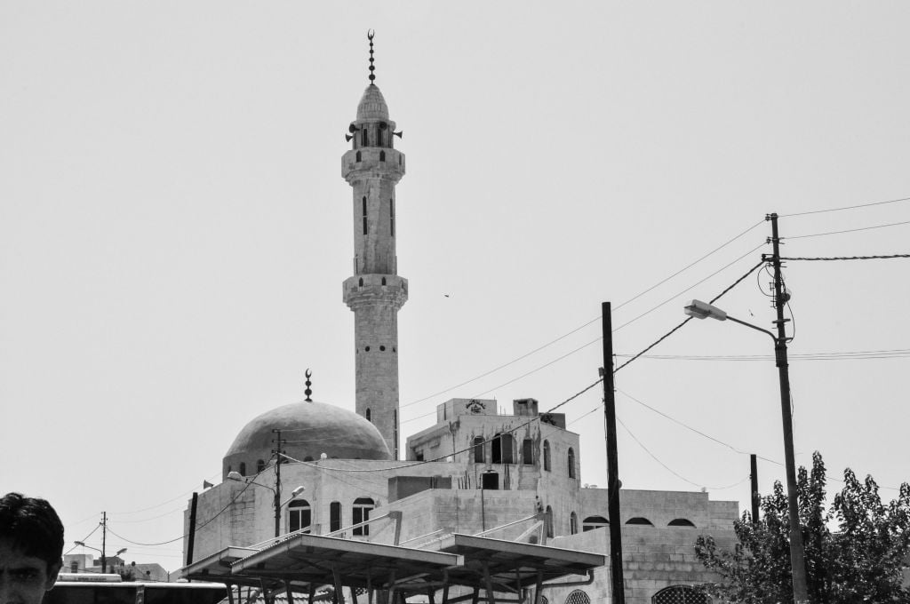 A mosque outside one of the main bus stations on the outskirts of Amman (photo credit: Michal Shmulovich/Times of Israel)