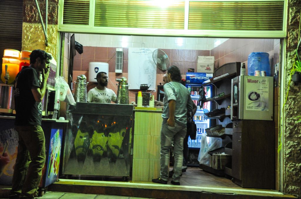 Cab drivers frequent Amman's little coffee-to-go shops, which have busboys who bring people their drinks (photo credit: Michal Shmulovich/Times of Israel)