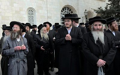 Ultra-Orthodox men pray in front of the Jerusalem Police headquarters in 2012 (photo credit: Flash90)