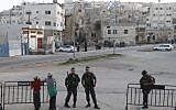 File: Jewish settlers and Israeli border policemen outside of Hebron's Beit Hamachpela in April 2012. (Miriam Alster/Flash90)