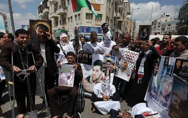 Relatives of Palestinians prisoners take part in a protest calling for their release, in Ramallah in April (Photo credit: Issam Rimawi/Flash90) Relatives of Palestinians prisoners take part in a protest calling for their release, in Ramallah in April (Photo credit: Issam Rimawi/Flash90)