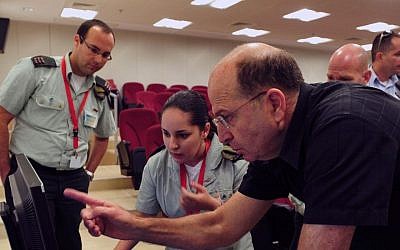 An illustrative photo of Defense Minister Moshe Ya'alon visiting the governmental department of telecom and cyber systems in June 2013 (Ariel Hermoni/Ministry of Defense/Flash90)