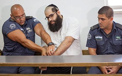 Daniel Maoz in the Jerusalem District court on July 1, 2013. The Jerusalem Disctrict Court handed down two consecutive life sentences for Daniel Maoz, who was convicted of murdering his parents. (photo credit: Emil Salman/POOL/Flash 90)