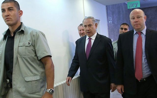 Benjamin Netanyahu, center, walking to a cabinet meeting Sunday, with Gil Shefer at right. (photo credit: Miri Tzahi/ Pool/ Flash90) Benjamin Netanyahu, center, walking to a cabinet meeting Sunday, with Gil Shefer at right. (photo credit: Miri Tzahi/ Pool/ Flash90)
