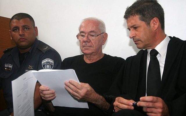 Former judge Dan Cohen (center) with his attorney Eitan Maoz, at court in Tel Aviv, on July 11, 2013. (photo credit: Roni Schutzer/Flash90) Former judge Dan Cohen (center) with his attorney Eitan Maoz, at court in Tel Aviv, on July 11, 2013. (photo credit: Roni Schutzer/Flash90)