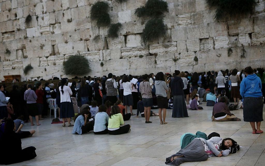 Taking a rest while praying through the night (photo credit: Miriam Alster/Flash 90)