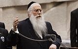 United Torah Judaism MK Meir Porush handcuffs himself to the microphone on the lectern in the Knesset plenum, during a speech about efforts to draft Haredim, on Tuesday, July 23, 2013. (photo credit: Flash90)