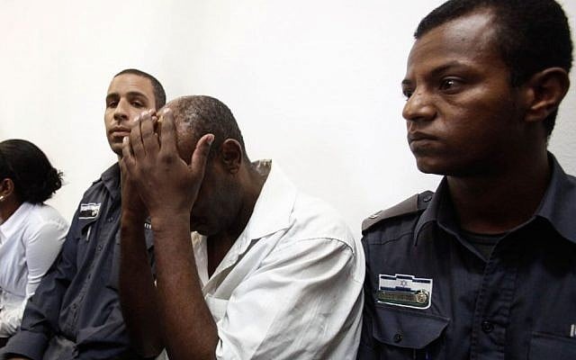 A security guard arrested for the shooting of a father/daughter legal team at their family-owned law office Jerusalem, seen in the Magistrate's Court in Jerusalem on July 24, 2013. (photo credit: Flash90) A security guard arrested for the shooting of a father/daughter legal team at their family-owned law office Jerusalem, seen in the Magistrate's Court in Jerusalem on July 24, 2013. (photo credit: Flash90)