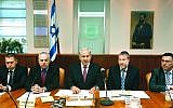 Prime Minister Benjamin Netanyahu (center) flanked by ministers at the cabinet meeting on July 28, 2013. (photo credit: Miri Tzahi/Flash90)